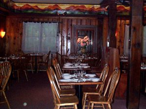 The dining room in West Hurley. Murals and flowers by my Mom, Louisa, who still brings fresh flowers to Terrapin every week and whose paintings now decorate the dining room in Rhinebeck.