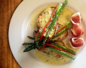 Terrapin Grilled Asparagus and Serrano Ham over Ciabatta Toast with Green Chile Hollandaise